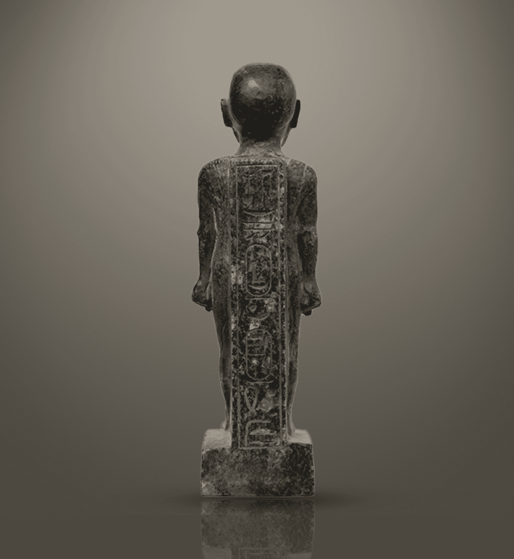 Granite statue of an Egyptian priest, representing spiritual strength and religious authority.