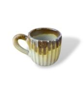 Nile Artisan handmade ceramic mug with earthy brown and beige vertical ribbed glaze.