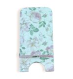 Front view of a decorative phone stand with a pastel floral pattern featuring roses and green leaves on a light background.