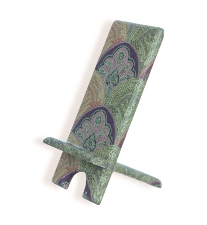 Side view of a decorative phone stand with intricate multicolor mandala pattern in green, purple, and pink.