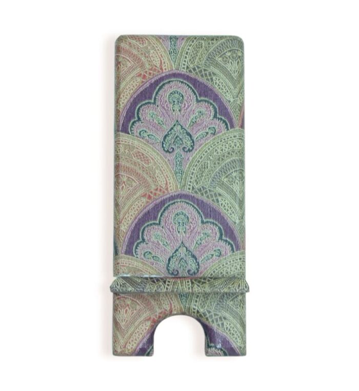 Decorative phone stand with intricate Middle Eastern-inspired pattern in green, purple, and pink tones.
