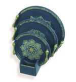 Set of three navy wooden mandala trays with gold handles in matching holder.
