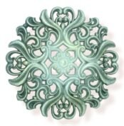 Ornate decorative design with intricate swirls and floral patterns, featuring a vintage green finish.