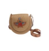 Scarab Glow handmade straw bag front view with colorful scarab beetle artwork and brown strap.