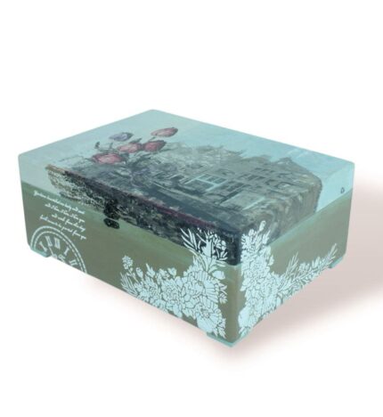 Closed Box London with London cityscape design on the lid, clock motif, and floral accents.