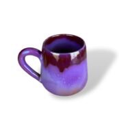 Glossy purple ceramic mug with deep burgundy glaze flowing from the rim, creating a rich contrast and regal effect.