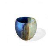Specter of Civilization handmade ceramic cup with round form and blue-beige gradient glaze.