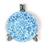 Round blue floral coaster displayed on a stand, featuring intricate flower and leaf patterns.