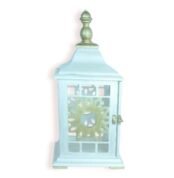 Front view of vintage pastel blue lantern with sunburst cut-out design and metallic top.