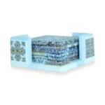 Set of decorative coasters with colorful geometric tile patterns in a matching holder.