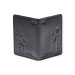 Back view of a black leather passport cover embossed with ancient Egyptian deities and pharaonic symbols.