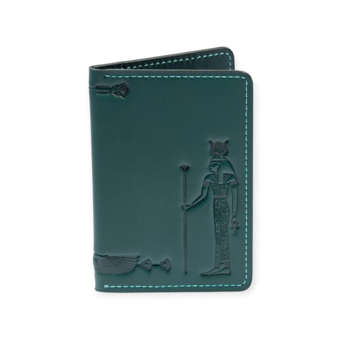 Closed green leather card holder with an embossed figure of the ancient Egyptian sun god Ra.