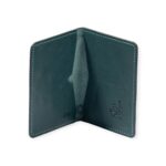 Open view of a green leather passport cover embossed with ancient Egyptian deities and sacred symbols.