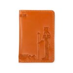 Closed Light havana leather card holder with an embossed figure of the ancient Egyptian sun god Ra.