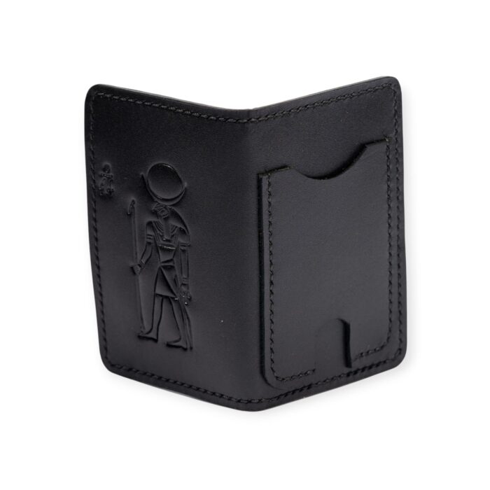 black leather card holder featuring an embossed ancient Egyptian figure design.