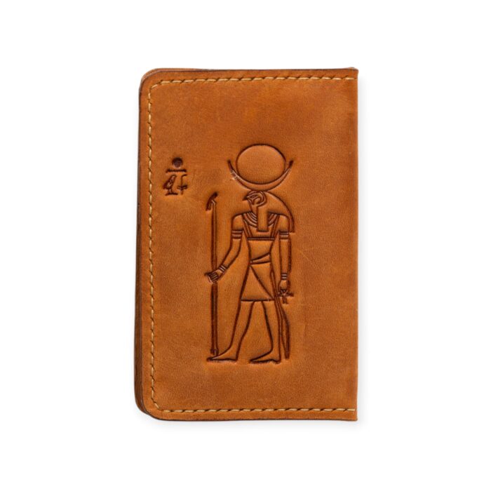 Closed view of a handcrafted Light Havana leather card holder embossed with the ancient Egyptian god Ra.