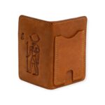 Handcrafted leather card holder in Light Havana color featuring an embossed ancient Egyptian figure.