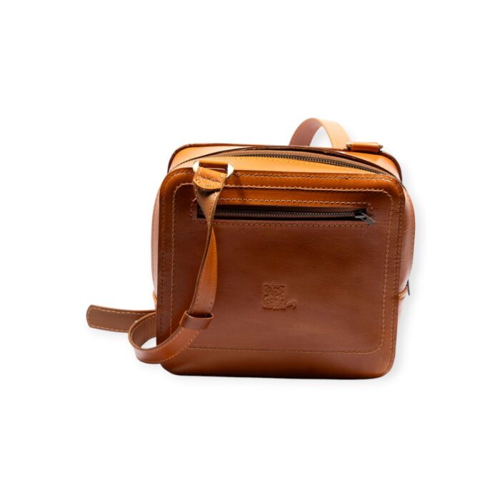 Square leather cross bag in brown with rear zipper pocket, back view.