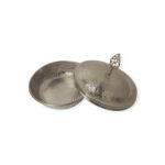 Silver serving dish with domed lid and ornate handle