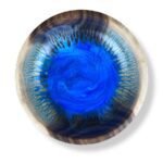 Resin wood bowl with circular bright blue resin core and light wood outer rim