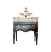 Vintage-style wooden cabinet with engraved floral patterns and gold accents.