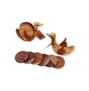 Set of duck-shaped wooden coasters with round wooden pieces spread out in front of two holders