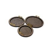 Three round handcrafted trays with intricate geometric patterns and gold handles arranged in a semi-circle.