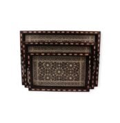 Set of three rectangular wooden trays with intricate mother-of-pearl inlay and arabesque patterns.