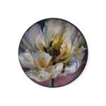 Decorative porcelain plate with detailed white flower painting and soft vintage background.