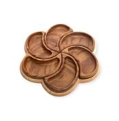 Top-down view of a wooden serving tray shaped like a six-petal flower with all compartments in place