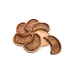Flower-shaped wooden tray with one petal-shaped section removed, revealing the base underneath