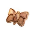 Butterfly-shaped wooden tray with multiple carved compartments in natural wood grain