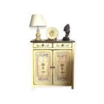 Hand-painted classic wooden cabinet with floral motifs and vintage decor items on top.