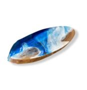 Angled view of oval wood resin centerpiece showing blue and white resin waves from the left side.