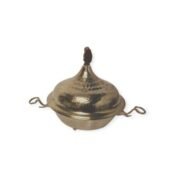 Hammered brass serving dish with domed lid, decorative top, and ornate side handles