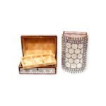 Multi-compartment wooden box with intricate geometric designs, open to reveal its organized interior.