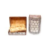 Multi-compartment wooden box with intricate geometric designs, open to reveal its organized interior.