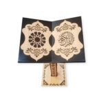 Top view of a wooden Quran stand with laser-cut Islamic designs and Arabic calligraphy on each panel