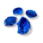 Set of handmade blue agate-style resin coasters with metallic silver edges.