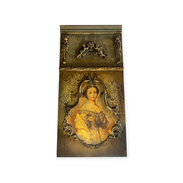 vintage wooden tableau with gold accents and portrait art