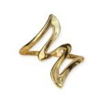 Gold-plated wave-shaped ring with flowing design on white background
