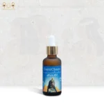 CairoCharm Hair Oil bottle with a close-up shot of the dropper, showing product texture.