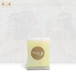 Lavender Breeze soap wrapped in yellow paper with Queen Tiye branding, delivering a refreshing and relaxing skincare experience.