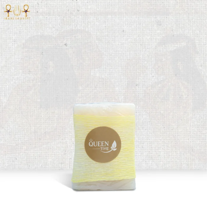 Lavender Breeze soap wrapped in yellow paper with Queen Tiye branding, delivering a refreshing and relaxing skincare experience.