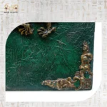 Detailed close-up of antique golden corner ornament on green textured wood