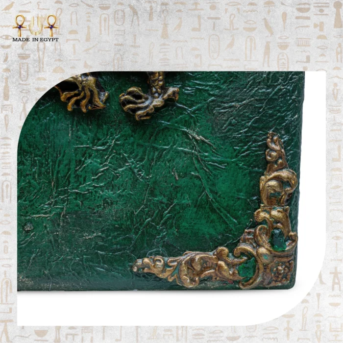 Detailed close-up of antique golden corner ornament on green textured wood