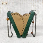 Side view of the Abundance Energy Bag showing V-shaped interior and chain strap