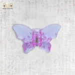 Butterfly-shaped hair clip viewed from the back, highlighting the spring mechanism and design details.