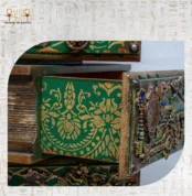 Close-up of intricate golden patterns on the Cabinet of Secrets drawer.