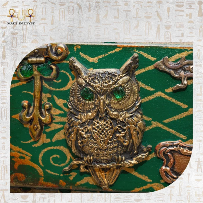Detailed view of an owl ornament on the Cabinet of Secrets.